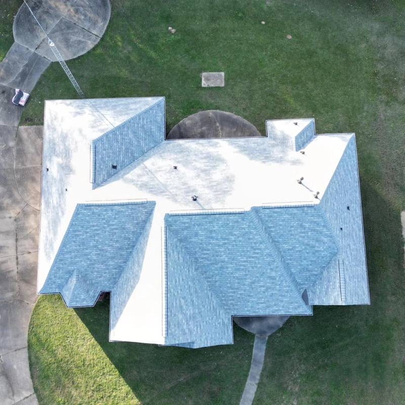 White roofed house with circle patio